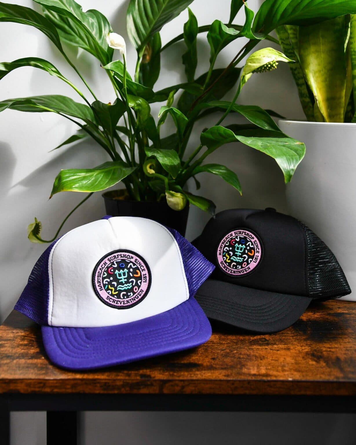Two trucker caps with an embroidered patch